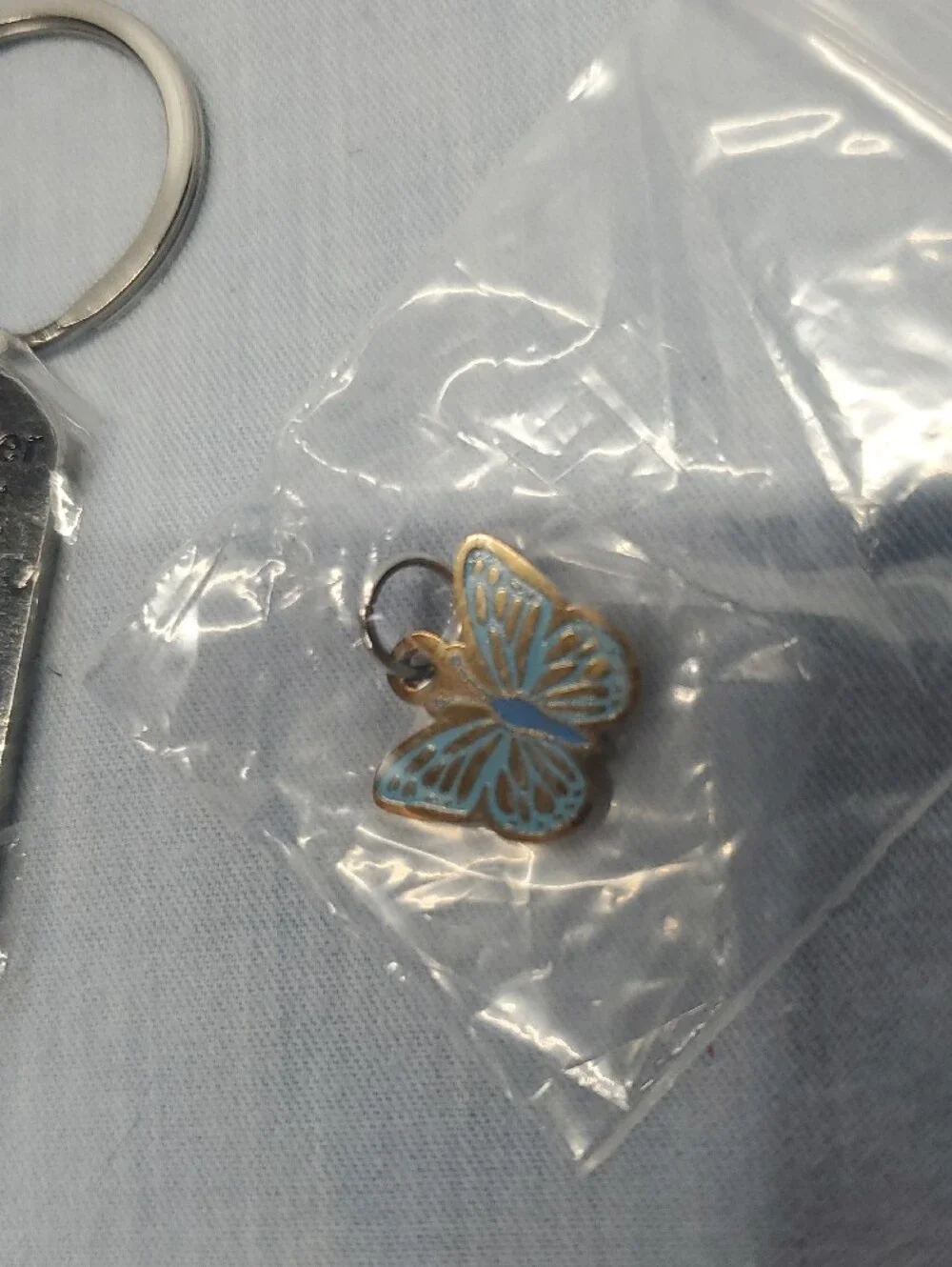 Silver Dog Tag Keychain with Blue Butterfly Charm